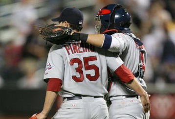 NEW YORK - JUNE 23:  Joel Pineiro #35 of the St. Louis Cardinals celebrates defeating the New York Mets with teammate Yadier Molina #4 at Citi Field on June 23, 2009 in the Flushing neighborhood of the Queens borough of New York City.  (Photo by Michael Heiman/Getty Images)