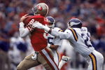 SAN FRANCISCO - DECEMBER 8:  Wide receiver Dwight Clark #87 of the San Francisco 49ers catches a pass against defensive back Rufus Bess #21 of the Minnesota Vikings during a game at Candlestick Park on December 8, 1984 in San Francisco, California.  The 49ers won 51-7.  (Photo by George Rose/Getty Images)