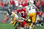 COLUMBUS, OH - SEPTEMBER 24:  Quarterback Drew Tate #5 of Iowa is sacked by Mike Kudla #57 of Ohio State as A.J. Hawak #47 of Ohio State and Marshal Yanda #73 of Iowa look on during the second quarter on September 24, 2005 at Ohio Stadium in Columbus, Ohio.  (Photo by Harry How/Getty Images)