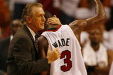 MIAMI - APRIL 29:  Guard Dwyane Wade #3 of the Miami Heat gets a hug from Head Coach Pat Riley in the fourth period against the Chicago Bulls in Game Four of the Eastern Conference Quarterfinals during the 2007 NBA Playoffs on April 29, 2007 at American Airlines Arena in Miami, Florida. The Bulls defeated the Heat 92-79 and sweep the best of seven series 4-0.  NOTE TO USER: User expressly acknowledges and agrees that, by downloading and or using this photograph, User is consenting to the terms and conditions of the Getty Images License Agreement.  (Photo by Eliot J. Schechter/Getty Images)