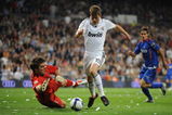 MADRID, SPAIN - APRIL 21: Klaas Jan Huntelaar of Real Madrid tries to get past  Vladimir Stojkovic of Getafe during the La Liga match between Real Madrid and Getafe at the Santiago Bernabeu stadium on April 21,  2009 in Madrid Spain.  (Photo by Denis Doyle/Getty Images)