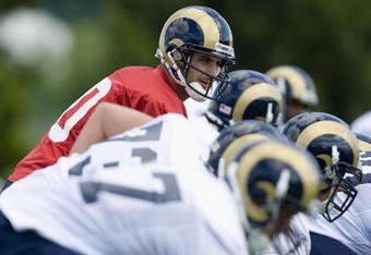 ST. LOUIS - JULY 31:  Marc Bulger #10 of the St. Louis Rams lines up behind the offensive line during training camp at the Russell Athletic Training Facility on July 31, 2009 in St. Louis, Missouri.  (Photo by Dilip Vishwanat/Getty Images)