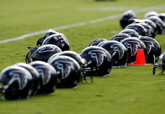FLOWERY BRANCH, GA - AUGUST 01:  Atlanta Falcons' helmets sit on field during opening day of training camp on August 1, 2009 at the Falcons Training Complex in Flowery Branch, Georgia.  (Photo by Kevin C. Cox/Getty Images)
