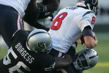 OAKLAND, CA - DECEMBER 3: Oakland Raiders defensive ends Derrick Burgess #56 and Kevin Huntley #94 sack Houston Texans quarterback David Carr #8 during their game on December 3, 2006 at McAfee Coliseum in Oakland, California. (Photo by Stephen Dunn/Getty Images)
