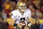LOS ANGELES - NOVEMBER 29:  Quarterback Jimmy Clausen #7 of the Notre Dame Fighting Irish moves back to pass the ball during the game against the USC Trojans at the Memorial Coliseum on November 29, 2008 in Los Angeles, California. (Photo by: Jeff Gross/Getty Images)