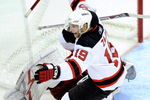 RALEIGH, NC - APRIL 19:  Travis Zajac #19 of the New Jersey Devils celebrates after scoring the game-wining goal in overtime against the Carolina Hurricanes during Game Three of the Eastern Conference Quarterfinals of the 2009 Stanley Cup Playoffs on April 19, 2009 at the RBC Center in Raleigh, North Carolina.  (Photo by Grant Halverson/Getty Images)