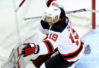 RALEIGH, NC - APRIL 19:  Travis Zajac #19 of the New Jersey Devils celebrates after scoring the game-wining goal in overtime against the Carolina Hurricanes during Game Three of the Eastern Conference Quarterfinals of the 2009 Stanley Cup Playoffs on April 19, 2009 at the RBC Center in Raleigh, North Carolina.  (Photo by Grant Halverson/Getty Images)