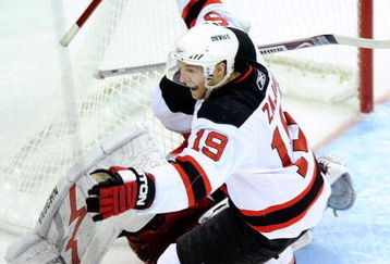 RALEIGH, NC - APRIL 19:  Travis Zajac #19 of the New Jersey Devils celebrates after scoring the game-wining goal in overtime against the Carolina Hurricanes during Game Three of the Eastern Conference Quarterfinals of the 2009 Stanley Cup Playoffs on April 19, 2009 at the RBC Center in Raleigh, North Carolina.  (Photo by Grant Halverson/Getty Images)