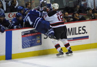 9 May 2001:  Bobby Holik of the New Jersey Devils  checks Gary Roberts of the Toronto Maple Leafs during the second period of Game 7 of the Eastern Conference semifinals at the Continental Airlines Arena in East Rutherford, New Jersey. Mandatory Credit: Al Bello/ALLSPORT