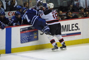 9 May 2001:  Bobby Holik of the New Jersey Devils  checks Gary Roberts of the Toronto Maple Leafs during the second period of Game 7 of the Eastern Conference semifinals at the Continental Airlines Arena in East Rutherford, New Jersey. Mandatory Credit: Al Bello/ALLSPORT