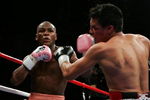 LAS VEGAS - NOVEMBER 04:  Carlos Baldomir (R) of Argentina connects to the face of Floyd Mayweather during their WBC Welterweight Championship fight at the Mandalay Bay Events Center November 4, 2006 in Las Vegas, Nevada. Mayweather won by unanimous decision to become new welterweight champion. (Photo by Ethan Miller/Getty Images)