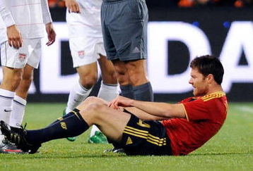 BLOEMFONTEIN, SOUTH AFRICA - JUNE 24: Landon Donovan #10 of USA gets a yellow card from referee Jorge Larrionda of Uruguay for a foul against Xabi Alonso #14 of Spain during the FIFA Confederations Cup Semi Final match between Spain and USA at the Free State stadium on June 24, 2009 in Bloemfontein, South Africa. USA won, 2-0, to advance to the finals.  (Photo by Kevork Djansezian/Getty Images)