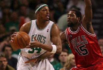 BOSTON - MAY 02:  Paul Pierce #34 of the Boston Celtics looks to pass as John Salmons #15 of the Chicago Bulls defends in Game Seven of the Eastern Conference Quarterfinals during the 2009 NBA Playoffs at TD Banknorth Garden on May 2, 2009 in Boston, Massachusetts. The Celtics defeated the Bulls 109-99. NOTE TO USER: User expressly acknowledges and agrees that, by downloading and or using this photograph, User is consenting to the terms and conditions of the Getty Images License Agreement.  (Photo by Elsa/Getty Images)