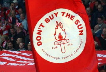LIVERPOOL, ENGLAND - APRIL 11:  Liverpool fans display banners in reference to the Hillsborough disaster during the Barclays Premier League match between Liverpool and Blackburn at Anfield on April 11, 2009 in Liverpool, England. On April 15 it will be the 20th anniversary of the Hillsborough disaster, the bells of Liverpools two cathedrals will ring 96 times in memory of the 96 fans who lost their lives. At 3:06pm, exactly 20 years since the match was abandoned Liverpools public transport will stop for 2 minutes. There will also be a memorial service on the Kop where 96 candles will be lit and a representative from each family will be awarded the freedom of the city. (Photo by Clive Rose/Getty Images)