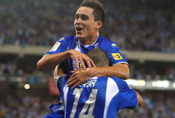 BARCELONA, SPAIN - AUGUST 02: Jose Callejon of RCD Espanyol celebrates with Ben Sahar (#14) after Sahar scored a goal against Liverpool during a pre- season friendly match at the Nuevo Estadio de Cornella-El Prat stadium on August 2, 2009 in Barcelona, Spain.  (Photo by Denis Doyle/Getty Images)