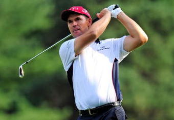 AKRON, OH - AUGUST 06:  Padraig Harrington of Ireland plays his approach shot on the ninth hole during the first round of the World Golf Championship Bridgestone Invitational on August 6, 2009 at Firestone Country Club in Akron, Ohio.  (Photo by Stuart Franklin/Getty Images)