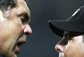 LOS ANGELES - JULY 24:  Manager Bruce Bochy #15 of the San Diego Padres argues his ejection with first base umpire James Hoye in the 12th inning against the the Los Angeles Dodgers on July 24, 2006 at the Rogers Centre in Toronto, Canada.  (Photo by Harry How/Getty Images)