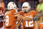 AUSTIN, TX - NOVEMBER 27:  Quarterback Colt McCoy #12 of the Texas Longhorns is congratulated by Jordan Shipley #8 during the game against the Texas A&M Aggies on November 27, 2008 at Darrell K Royal-Texas Memorial Stadium in Austin, Texas.  Texas won 49-9. (Photo by Brian Bahr/Getty Images)