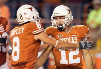 AUSTIN, TX - NOVEMBER 27:  Quarterback Colt McCoy #12 of the Texas Longhorns is congratulated by Jordan Shipley #8 during the game against the Texas A&M Aggies on November 27, 2008 at Darrell K Royal-Texas Memorial Stadium in Austin, Texas.  Texas won 49-9. (Photo by Brian Bahr/Getty Images)