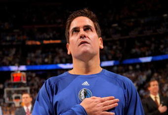 DENVER - MAY 05:  Mark Cuban, owner of the Dallas Mavericks observes the national anthem prior to facing the Denver Nuggets in Game Two of the Western Conference Semifinals during the 2009 NBA Playoffs at Pepsi Center on May 5, 2009 in Denver, Colorado. The Nuggets defeated the Mavericks 117-105. NOTE TO USER: User expressly acknowledges and agrees that, by downloading and or using this photograph, User is consenting to the terms and conditions of the Getty Images License Agreement.  (Photo by Doug Pensinger/Getty Images)