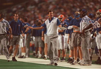 3 Dec 1994:  Head coach Steve Spurrier (center) of the Florida Gators walks onto the field to dispute a call during a play in the Gators 24-23 victory over the Alabama Crimson Tide in the SEC Championship game in Mobile, Alabama.   Mandatory Credit: Doug