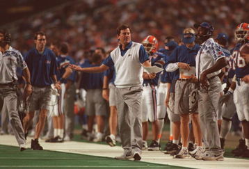 3 Dec 1994:  Head coach Steve Spurrier (center) of the Florida Gators walks onto the field to dispute a call during a play in the Gators 24-23 victory over the Alabama Crimson Tide in the SEC Championship game in Mobile, Alabama.   Mandatory Credit: Doug