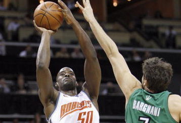 CHARLOTTE, NC - MARCH 16:  Emeka Okafor #50 of the Charlotte Bobcats takes a shot against Andrea Bargnani #7 of the Toronto Raptors during their game at Time Warner Cable Arena on March 16, 2009 in Charlotte, North Carolina.  NOTE TO USER: User expressly acknowledges and agrees that, by downloading and/or using this Photograph, user is consenting to the terms and conditions of the Getty Images License Agreement. (Photo by: Streeter Lecka/Getty Images)