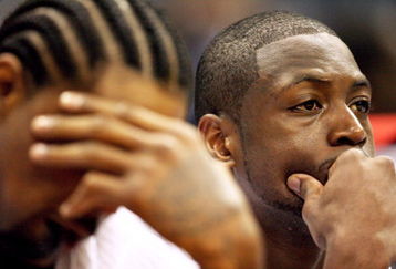ATLANTA - APRIL 19: Udonis Haslem #40, L, and Dwyane Wade #3 of the Miami Heat sit on the bench during the final seconds of their loss to the Atlanta Hawks during Game One of the First Round of the Eastern Conference Playoffs at Philips Arena on April 19, 2009 in Atlanta, Georgia. The Hawks defeated the Heat 90-64. NOTE TO USER: User expressly acknowledges and agrees that, by downloading and/or using this Photograph, user is consenting to the terms and conditions of the Getty Images License Agreement. (Photo by Doug Benc/Getty Images)