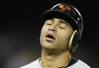 ANAHEIM, CA - AUGUST 11:  Jerry Hairston #15 of the Baltimore Orioles reacts to flying out on a hard hit ball to center field against the Anaheim Angels on August 11, 2004 at Angel Stadium of Anaheim in Anaheim, California. (Photo by Streeter Lecka/Getty Images)
