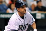 ST. PETERSBURG, FL - APRIL 15: Designed hitter Pat Burrell #5 of the Tampa Bay Rays bats against the New York Yankees at Tropicana Field on April 15, 2009 in St. Petersburg, Florida. All Major League Baseball players are wearing #42 in honor of Jackie Robinson day. (Photo by Al Messerschmidt/Getty Images)