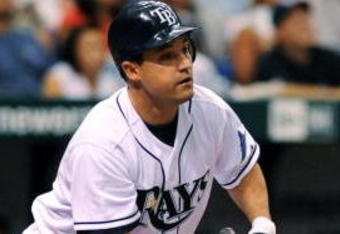 ST. PETERSBURG, FL - APRIL 15: Designed hitter Pat Burrell #5 of the Tampa Bay Rays bats against the New York Yankees at Tropicana Field on April 15, 2009 in St. Petersburg, Florida. All Major League Baseball players are wearing #42 in honor of Jackie Robinson day. (Photo by Al Messerschmidt/Getty Images)