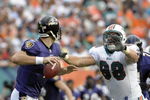 MIAMI, FL - JANUARY 4:  Linebacker Matt Roth #98 of the Miami Dolphins rushes quarterback Joe Flacco #5 of the Baltimore Ravens in an NFL Wildcard Playoff Game at Dolphins Stadium on January 4, 2009 in Miami, Florida.  (Photo by Al Messerschmidt/Getty Images) 