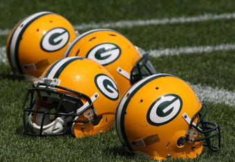 GREEN BAY, WI - AUGUST 03: Helmets sit on the field during the Green Bay Packers practice at summer training camp on August 3, 2009 at the Ray Nitschke Field in Green Bay, Wisconsin. (Photo by Jonathan Daniel/Getty Images)