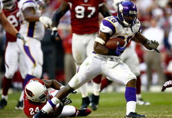 GLENDALE, AZ - DECEMBER 14:  Runningback Adrian Peterson #28 of the Minnesota Vikings breaks the tackle of Adrian Wilson #24 of the Arizona Cardinals during the game at the University of Phoenix Stadium on December 14, 2008 in Glendale, Arizona. The Vikings defeated the Cardinals 35-14.  (Photo by Jeff Gross/Getty Images)