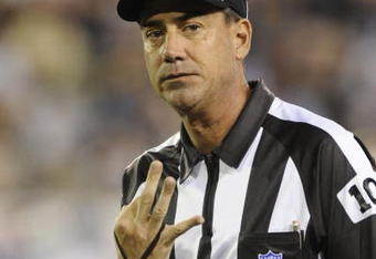 CANTON, OH - AUGUST 3: Line judge Gary Arthur of the NFL signals a third down as the Indianapolis Colts play against the Washington Redskins in the Pro Football Hall of Fame Game at Fawcett Stadium on August 3, 2008 in Canton, Ohio.   (Photo by Al Messerschmidt/Getty Images) 
