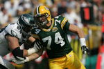 GREEN BAY, WI - SEPTEMBER 09: Aaron Kampman #74 of the Green Bay Packers rushes against Jon Runyan #69 of the Philadelphia Eagles on September 9, 2007 at Lambeau Field in Green Bay, Wisconsin. The Packers defeated the Eagles 16-13. (Photo by Jonathan Daniel/Getty Images)