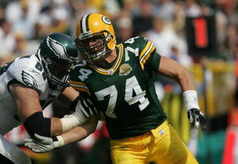GREEN BAY, WI - SEPTEMBER 09: Aaron Kampman #74 of the Green Bay Packers rushes against Jon Runyan #69 of the Philadelphia Eagles on September 9, 2007 at Lambeau Field in Green Bay, Wisconsin. The Packers defeated the Eagles 16-13. (Photo by Jonathan Daniel/Getty Images)