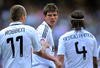 MADRID, SPAIN - MARCH 22:  Klaas Jan Huntelaar of Real Madrid celebrates with Arjen Robben and Sergio Ramos after scoring Real's second goal during the La Liga match between Real Madrid and UD Almeria at the Santiago Bernabeu stadium on March 22, 2009 in Madrid, Spain.  (Photo by Denis Doyle/Getty Images)