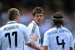 MADRID, SPAIN - MARCH 22:  Klaas Jan Huntelaar of Real Madrid celebrates with Arjen Robben and Sergio Ramos after scoring Real's second goal during the La Liga match between Real Madrid and UD Almeria at the Santiago Bernabeu stadium on March 22, 2009 in Madrid, Spain.  (Photo by Denis Doyle/Getty Images)