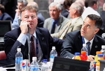 MONTREAL, QC - JUNE 27:  (L-R) General Manager Mike Gillis and assistant General Manager Laurence Gilman of the Vancouver Canucks sit at the draft table during the 2009 NHL Entry Draft at the Bell Centre on June 27, 2009 in Montreal, Quebec, Canada. (Photo by Bruce Bennett/Getty Images) 