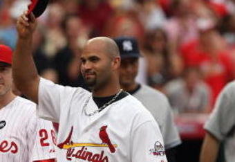 ST. LOUIS, MO - JULY 14:  National League All-Star Albert Pujols of the St. Louis Cardinals tips his hat during introductions before the 2009 MLB All-Star Game at Busch Stadium on July 14, 2009 in St. Louis, Missouri. (Photo by Dilip Vishwanat/Getty Images)