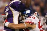 MINNEAPOLIS - DECEMBER 28:   Quarterback Tarvaris Jackson #7 of the Minnesota Vikings is hit by Bryan Kehl #53 of the New York Giants on December 28, 2008 at the Hubert H. Humphrey Metrodome in Minneapolis, Minnesota. (Photo by Elsa/Getty Images)