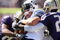 SEATTLE - SEPTEMBER 6:  Nate Williams #8 and Mesphin Forrester #23 of the Washington Huskies tackle a  BYU Cougars player during their game on September 6, 2008 at Husky Stadium in Seattle, Washington. The Cougars defeated the Huskies 28-27. (Photo by Otto Greule Jr/Getty Images)