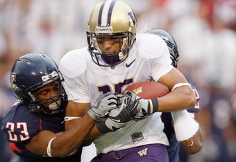 TUSCON - OCTOBER 4:  Jermaine Kearse #15 of the Washington Huskies grips the ball as he is tackled by Marquis Hundley #23 of the Arizona Wildcats on October 4, 2008 at Arizona Stadium in Tucson, Arizona. (Photo by: Gregory Shamus/Getty Images)