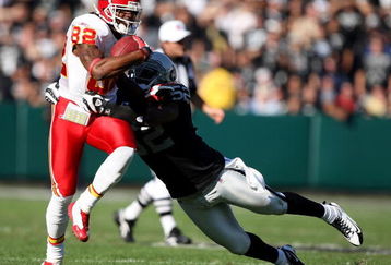 OAKLAND, CA - NOVEMBER 30: Dwayne Bowe #82 of the Kansas City Chiefs catches a pass over Kirk Morrison #52 of the Oakland Raiders during an NFL game on November 30, 2008 at the Oakland-Alameda County Coliseum in Oakland, California. (Photo by Jed Jacobsohn/Getty Images)