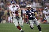 GLENDALE, AZ - FEBRUARY 03:  Kevin Boss #89 of the New York Giants runs for yards after the catch on a 45-yard reception against Rodney Harrison #37 of the New England Patriots in the fourth quarter of Super Bowl XLII on February 3, 2008 at the University of Phoenix Stadium in Glendale, Arizona.  (Photo by Andy Lyons/Getty Images)