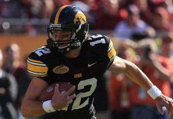 TAMPA, FL - JANUARY 01:  Ricky Stanzi #12 of the Iowa Hawkeyes runs upfield against the South Carolina Gamecocks during the Outback Bowl on January 1, 2009 at Raymond James Stadium in Tampa, Florida.  (Photo by Scott Halleran/Getty Images)