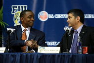 MIAMI - APRIL 15: Isiah Thomas (L) shakes the hand of Director of Athletics Pete Garcia after Thomas was introduced as the new head coach for Florida International Univeristy men's basketball team at U.S.Century Bank Arena on April 15, 2009 in Miami, Florida. (Photo by Doug Benc/Getty Images)