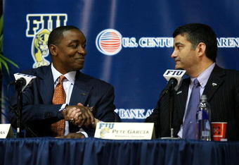 MIAMI - APRIL 15:  Isiah Thomas (L) shakes the hand of Director of Athletics Pete Garcia after Thomas was introduced as the new head coach for Florida International Univeristy men's basketball team at U.S.Century Bank Arena on April 15, 2009 in Miami, Florida.  (Photo by Doug Benc/Getty Images)