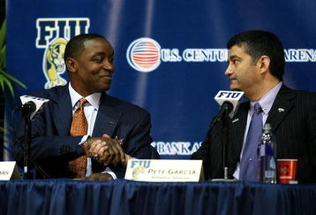 MIAMI - APRIL 15:  Isiah Thomas (L) shakes the hand of Director of Athletics Pete Garcia after Thomas was introduced as the new head coach for Florida International Univeristy men's basketball team at U.S.Century Bank Arena on April 15, 2009 in Miami, Florida.  (Photo by Doug Benc/Getty Images)
